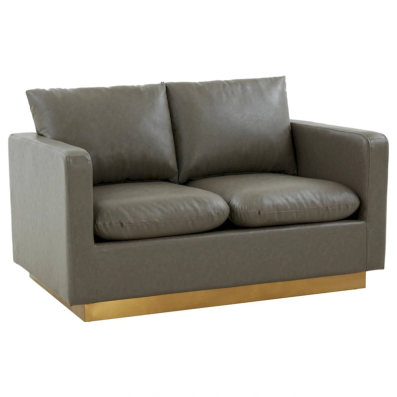 Poltroncina moderna in pelle con base dorata e cuscini
