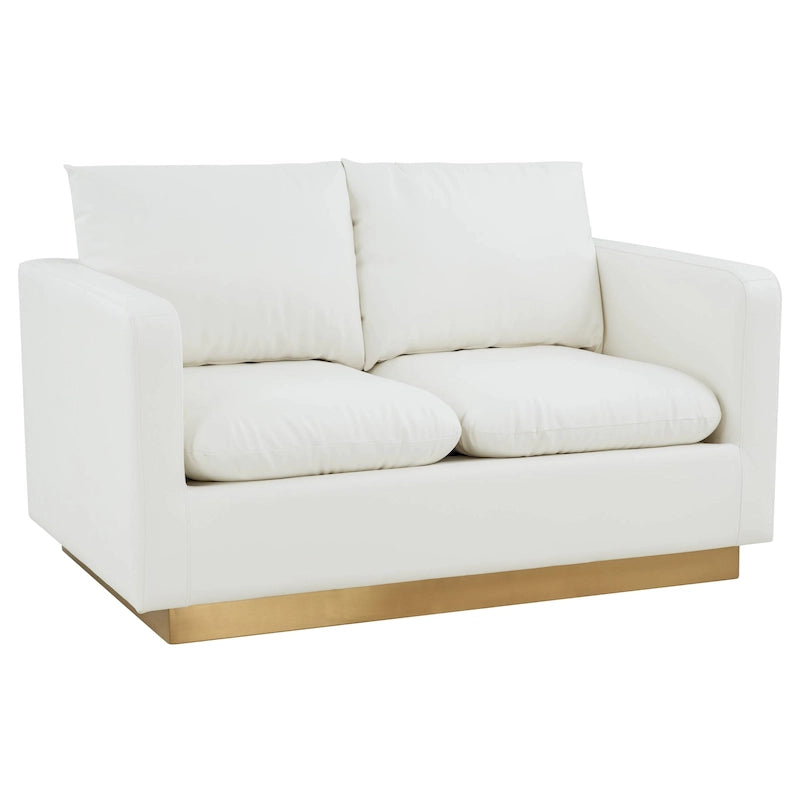 Poltroncina moderna in pelle con base dorata e cuscini