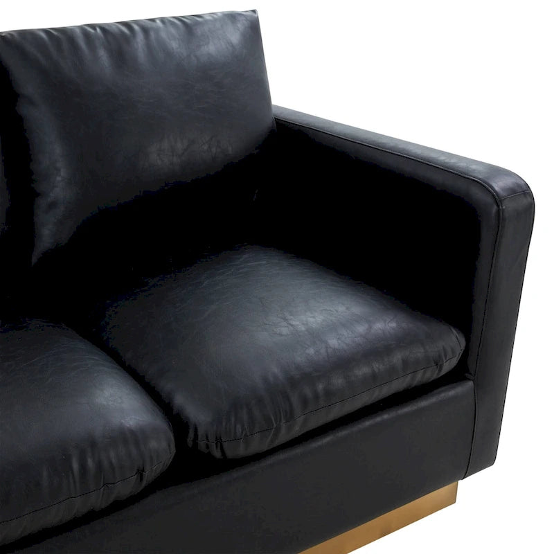 Poltroncina moderna in pelle con base dorata e cuscini