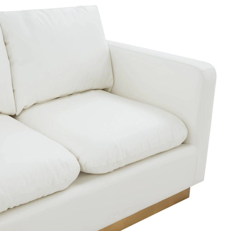 Causeuse moderne en cuir avec base dorée et coussins