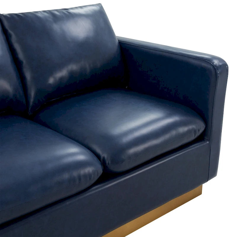 Causeuse moderne en cuir avec base dorée et coussins