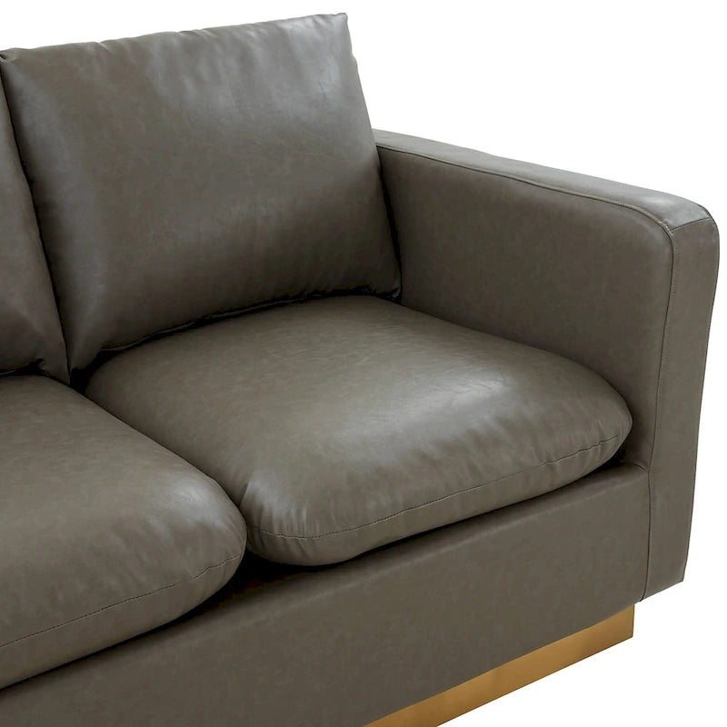 Causeuse moderne en cuir avec base dorée et coussins