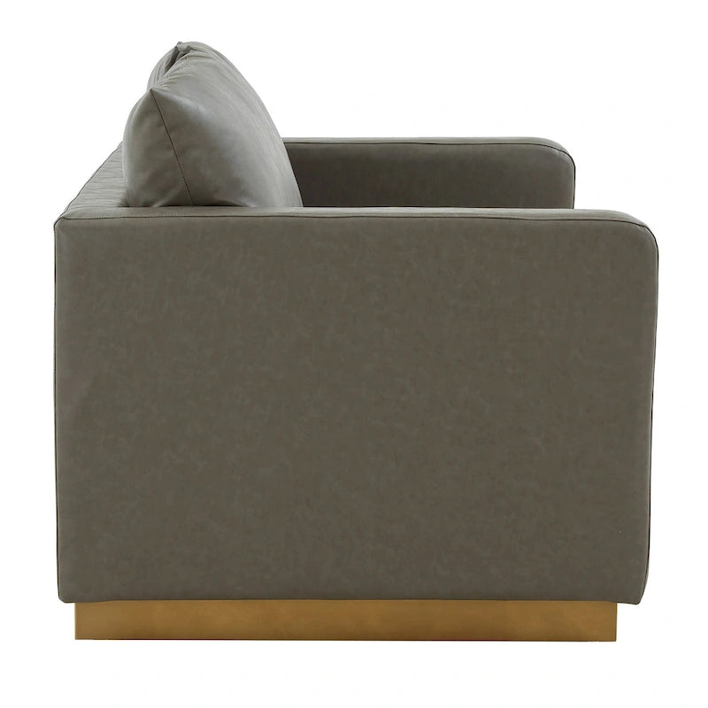 Causeuse moderne en cuir avec base dorée et coussins