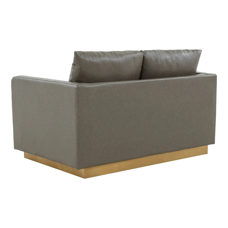 Causeuse moderne en cuir avec base dorée et coussins